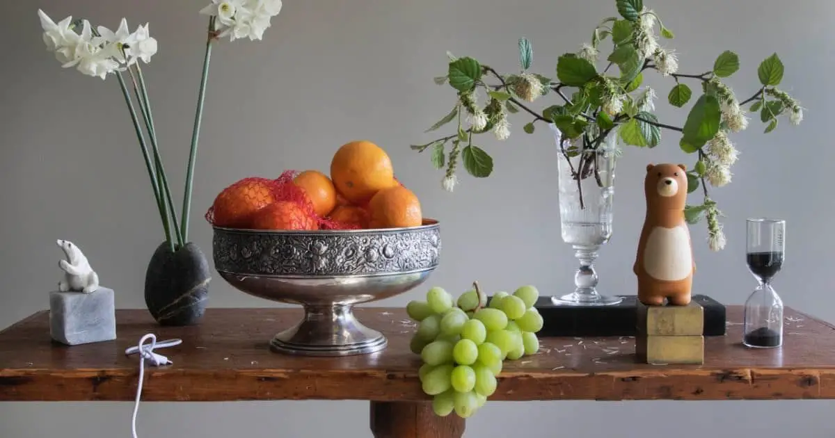 Six essential beginner tips for creating successful still life images, featuring a well-composed arrangement of objects on a table