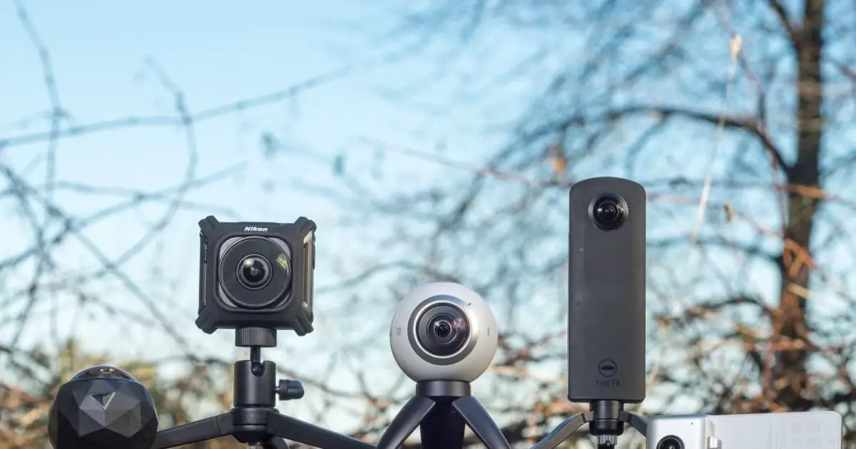 A collection of four different cameras arranged on a tripod, highlighting various models for photography purposes.