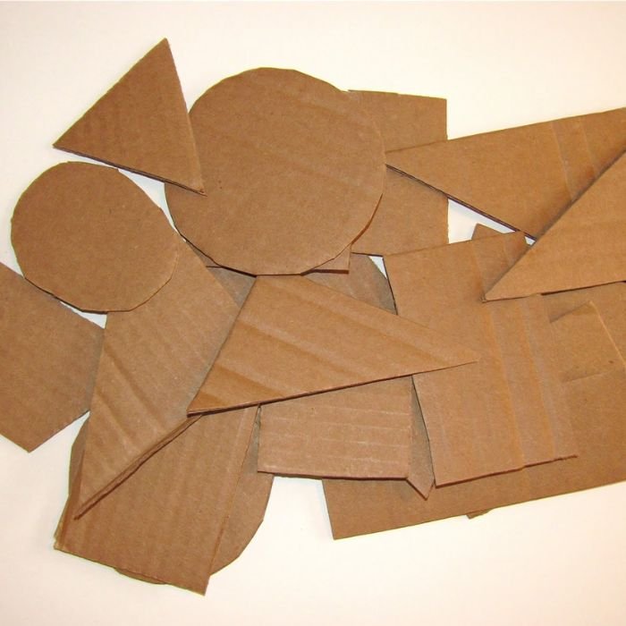 Cardboard shapes crafted from brown paper, showcasing innovative photography techniques and creative hacks.