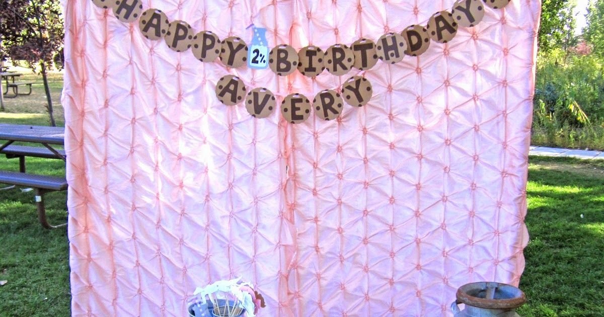 A colorful birthday banner displayed on a tent, serving as a festive photography prop for celebrations.