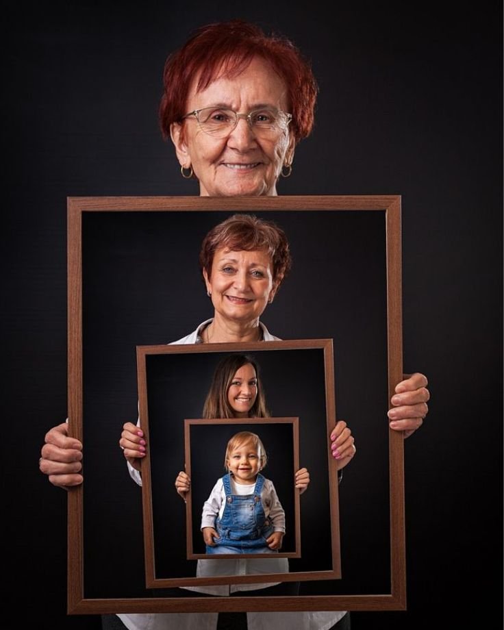 A grandmother displays two photographs of her granddaughter, surrounded by thoughtful photography props that enhance the moment.