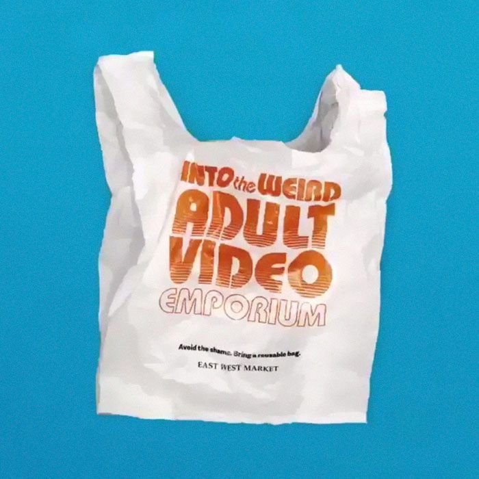 A bag containing adult videos displayed against a blue background, showcasing creative photography techniques.